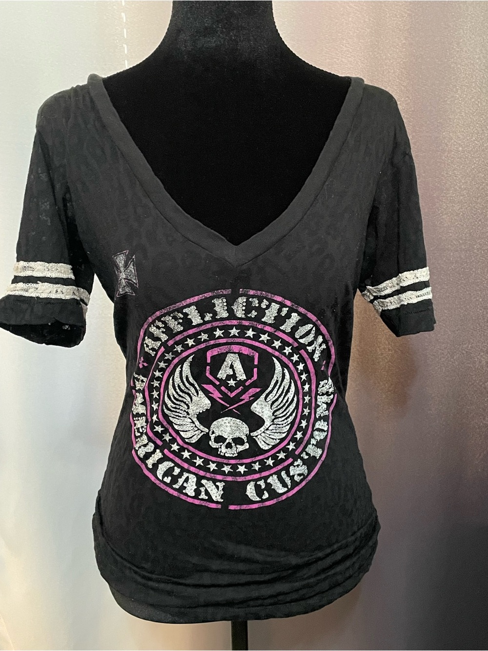 Affliction Black Short‑Sleeve V‑Neck Graphic Tee with Pink and White Accents